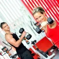 Group fitness class with participants mid-workout.