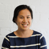 Portrait of Viv Luu smiling in a casual setting
